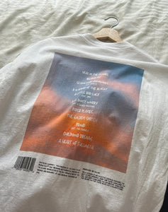 Close-up of back print on oversized white tee